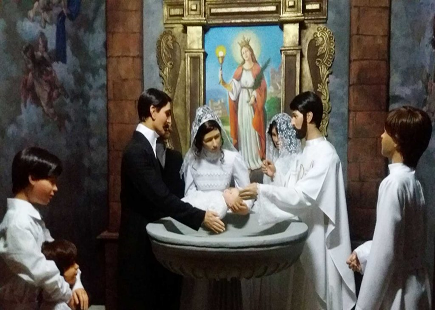 El niño Juan Pablo Duarte en la pila bautismal de la parroquia Santa Bárbara.